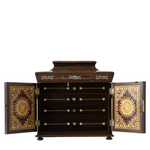 Antique jewelry box with ornate mother of pearl inlay and two open doors with gold details.