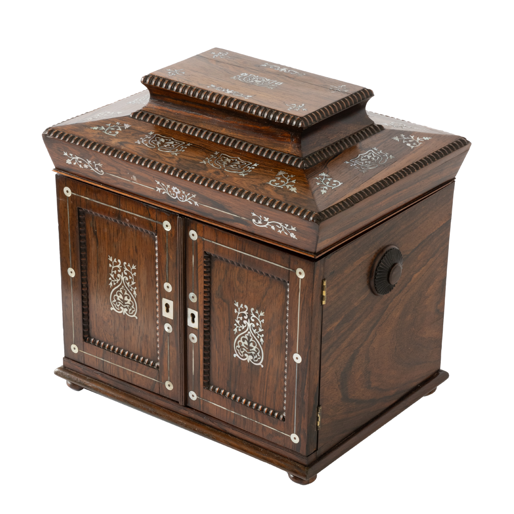 Antique jewelry box with ornate mother of pearl inlay and two doors.