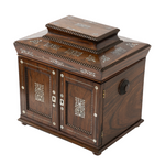 Antique jewelry box with ornate mother of pearl inlay and two doors.
