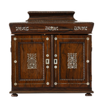 Antique jewelry box with ornate mother of pearl inlay and two doors.