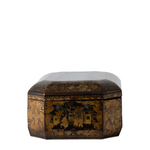 A small octagonal lacquered wooden box with a dark brown and gold floral pattern, featuring hand-painted figures on the front panel and a light gray lid, shown against a plain white background.