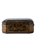 An antique octagonal lacquered box with a hinged lid, featuring intricate gold and black hand-painted chinoiserie landscape scenes on a white background.