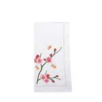 white dinner napkin with pink flowers and bees