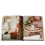 Open book showing a decorated interior with furniture and decor.