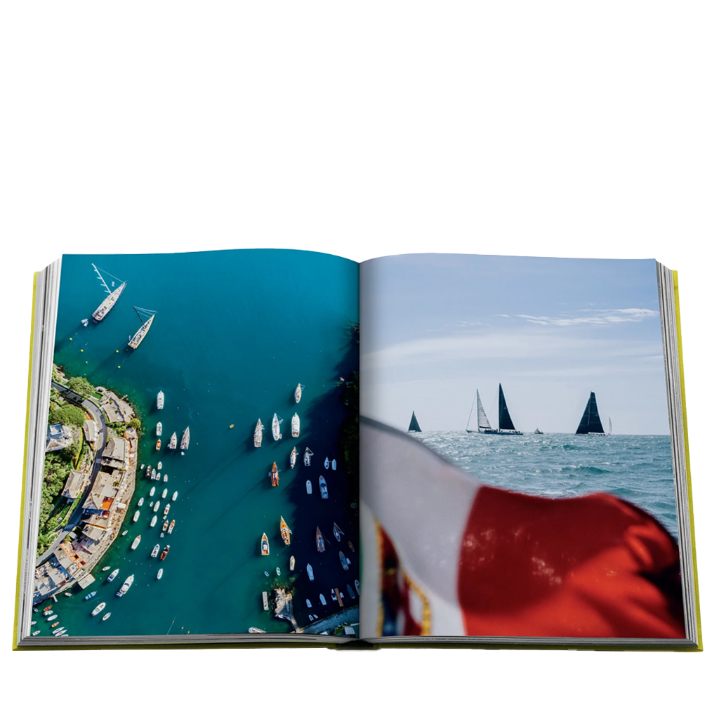 Open book showing images of sailboats on water