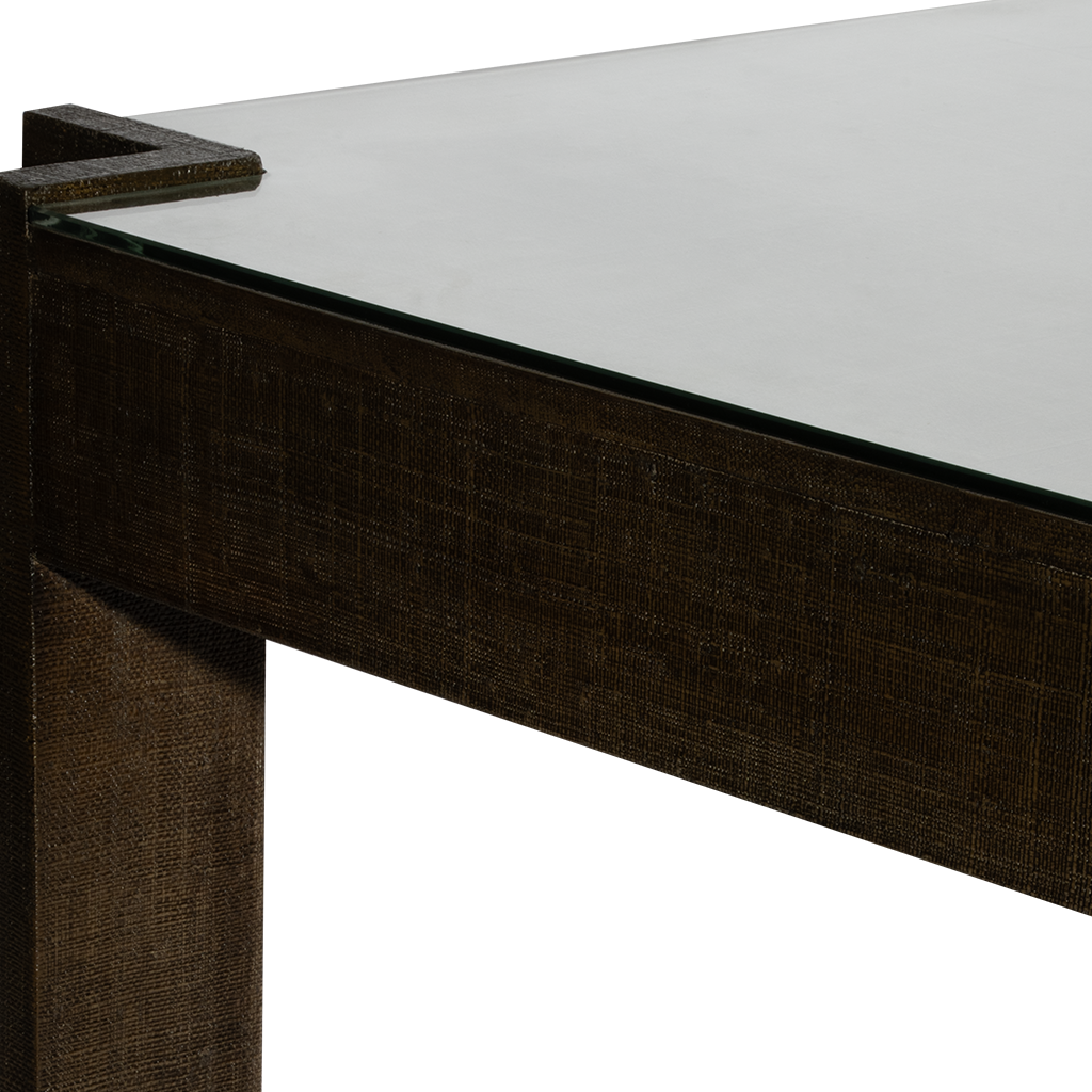Close-up of a dark wood table with a white surface