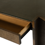 Close-up of a wooden table with glass top