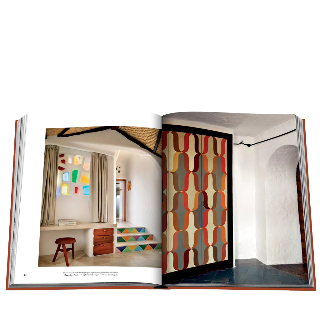 Open book showing interior design images with colorful patterns and furniture.