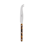 Tall dark-colored knife on a white background