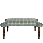 Plaid ottoman with wooden legs on a white background