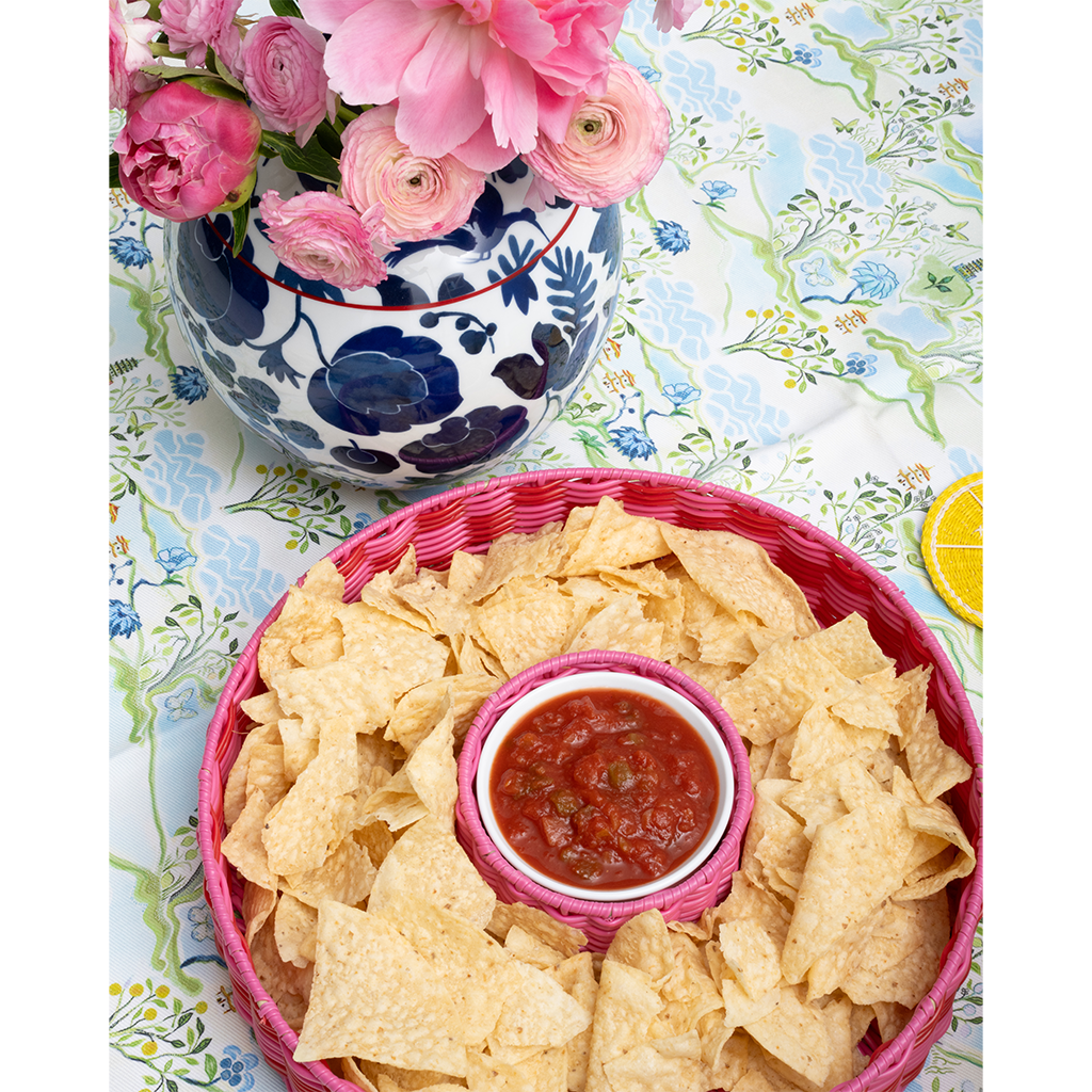 pink chip and dip server with salsa on a blue patterned tabelcloth
