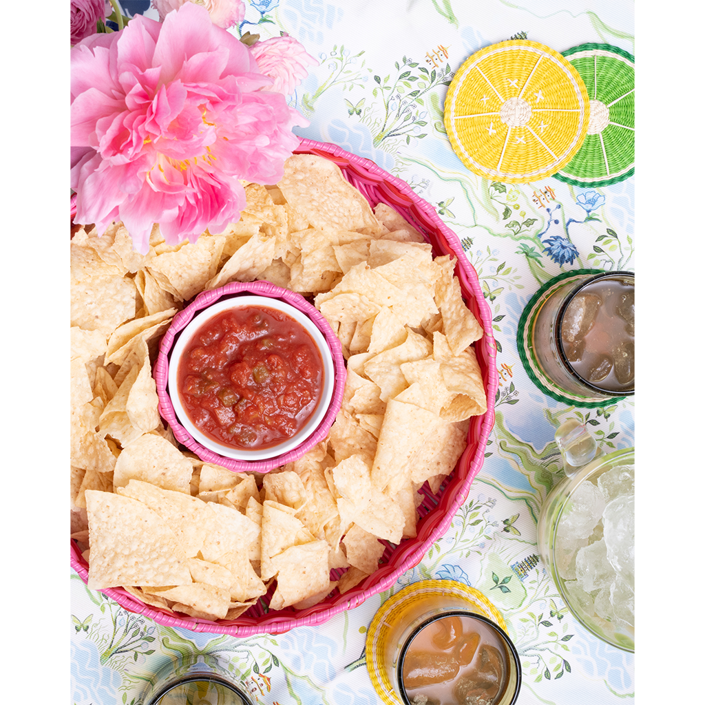 pink chip and dip server with salsa on a blue patterned tabelcloth