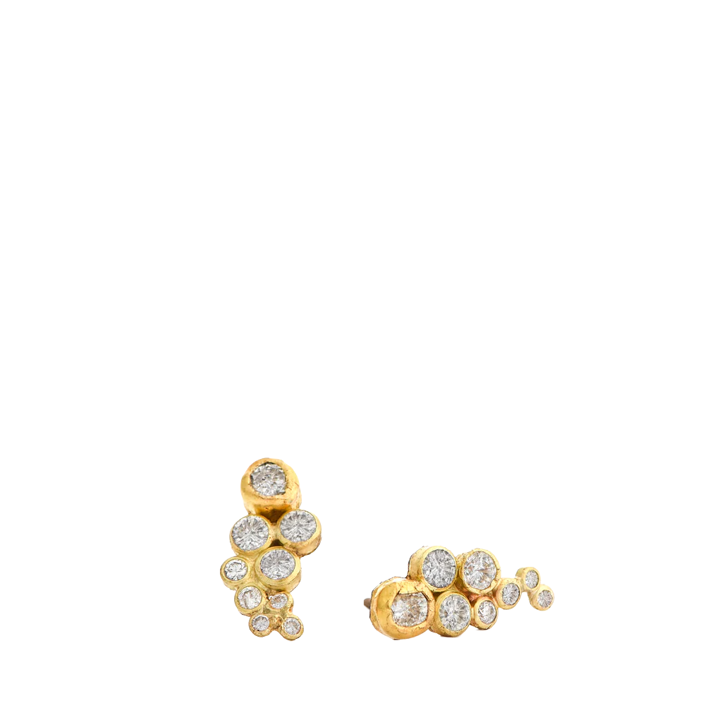 Gold earrings with diamond stones on a white background