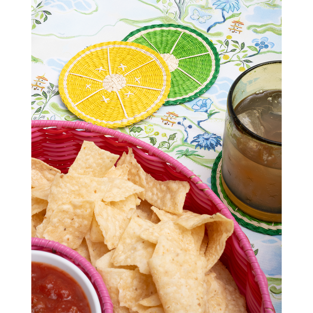 pink chip and dip server with salsa on a blue patterned tablecloth