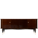 French mid-century modern lacquered sideboard, in the manner of Jacques Adnet. Rectangular case fitted with two sets of dual cabinet doors, one side opening to two drawers, and storage compartment, mirrored bottom panel, interior lighting in need of wiring, opposite side opening to two shelves, case rising on tapered legs ending on brass feet.