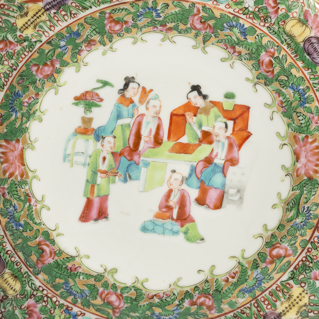Decorative plate with colorful floral and figural design