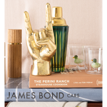 Decorative items including a gold hand-shaped object, cocktail shaker, and books on a surface.