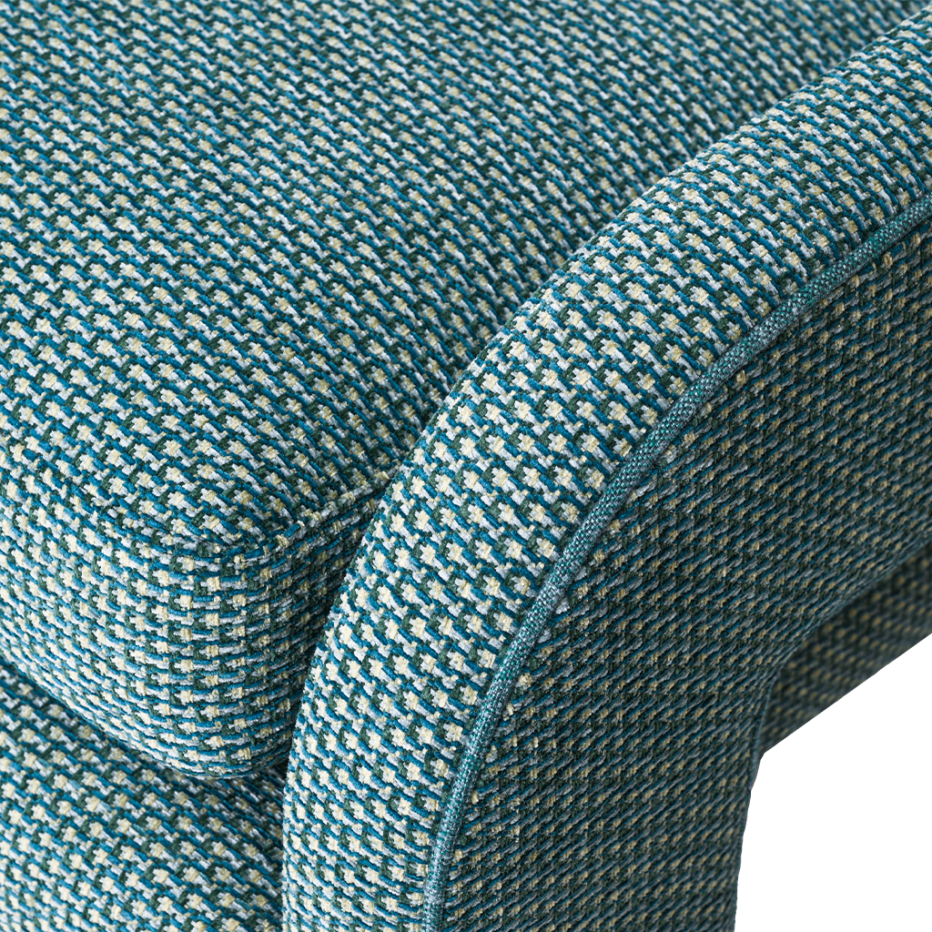 Close-up of textured teal fabric with a subtle pattern