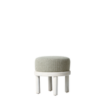 Small round stool with patterned cushion on a white background