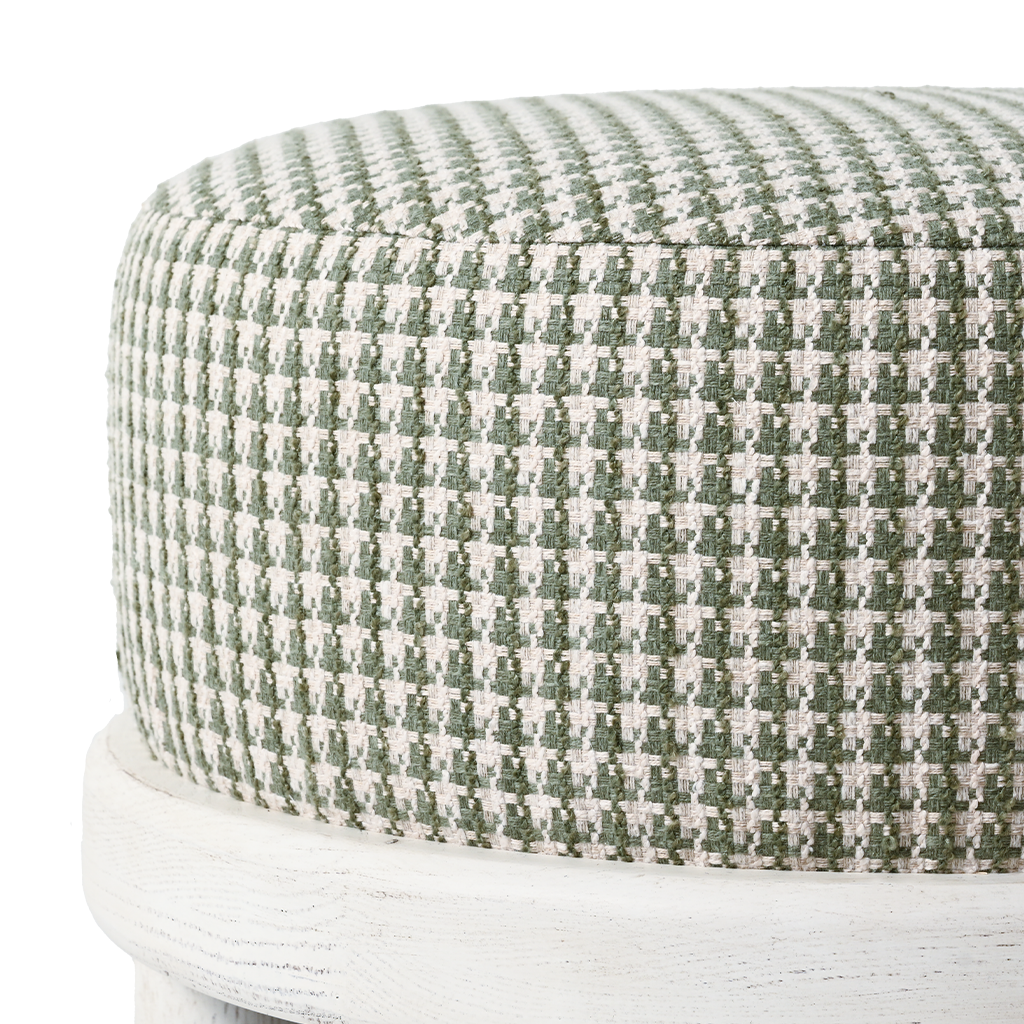 Round ottoman with green and white checkered pattern on a white background