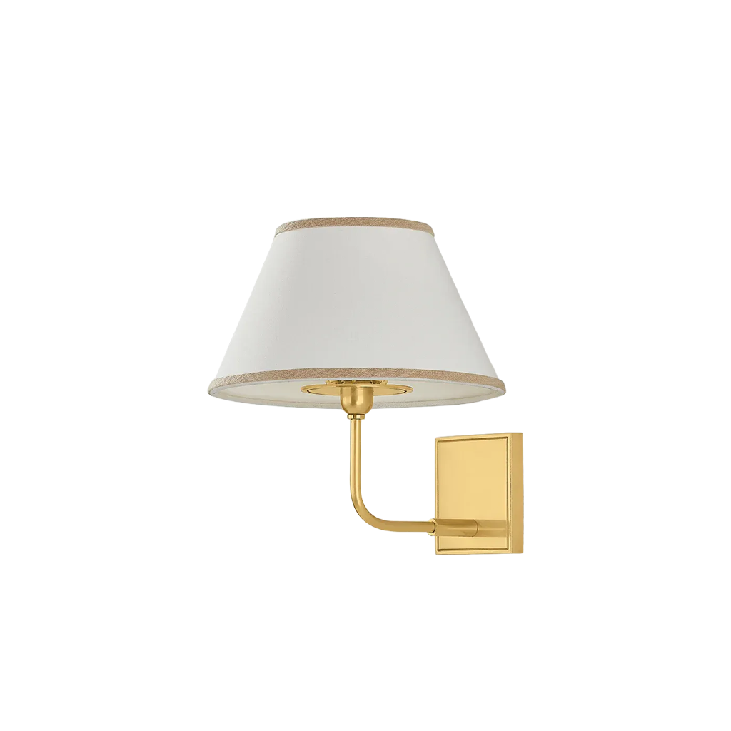 A modern wall-mounted sconce light fixture featuring a tapered white fabric shade with a gold trim, a curved gold metal arm, and a square gold wall plate, shown against a plain white background.