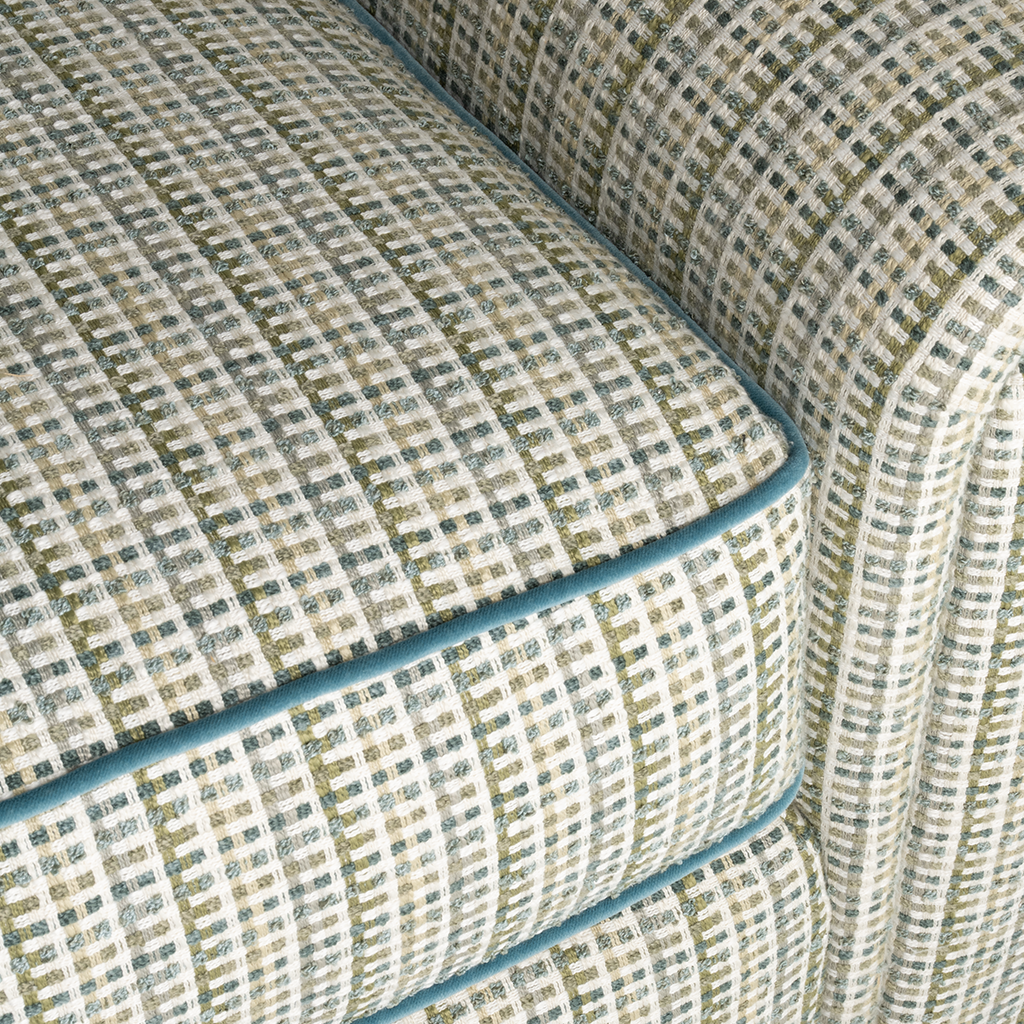 Close-up of a patterned sofa with a geometric design.