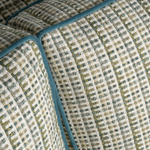 Close-up of textured fabric with geometric pattern in neutral colors