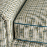 Close-up of a patterned fabric sofa with a checkered design.