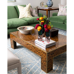 coffee table with green couch 