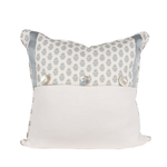 white pillow with blue flowers and trim