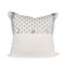 white pillow with blue flowers and trim