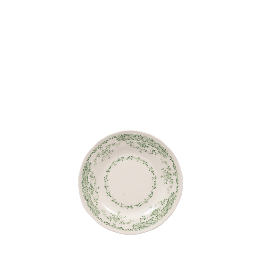 white ceramic plate with green floral design