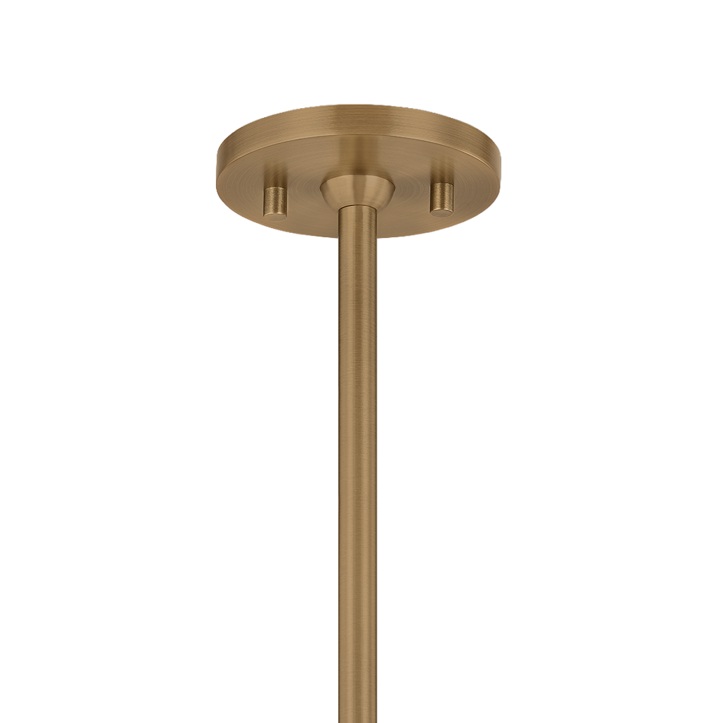 A close-up of a modern ceiling light fixture's round ceiling canopy and downrod in a brushed brass finish, shown against a solid white background.