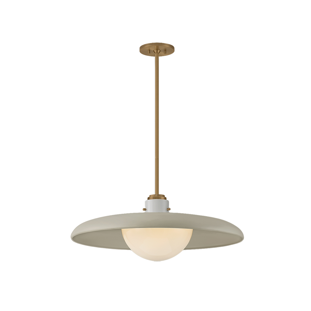 A modern pendant light fixture with a wide, shallow dome-shaped shade in a warm off-white finish, a central white ceramic accent, and a vertical brass-toned metal stem leading to a round ceiling canopy.