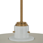A close-up of a pendant light fixture showing a white cylindrical shade base with small brass side tabs and a brushed brass ceiling mount rod against a white background.