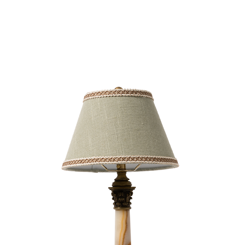 Small lamp with a decorative shade on a white background