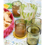 margarita glasses and an ice bucket on a blue patterned tablecloth