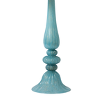 Turquoise glass lamp base with ribbed design on a white background
