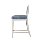 White bar stool with blue cushioned seat and backrest on a white background