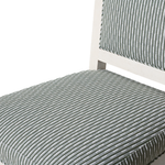 Close-up of a chair with striped gray cushion on a white background