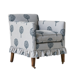 Chair with floral patterned slipcover on a white background