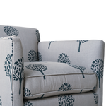 Gray sofa with blue tree pattern on a white background