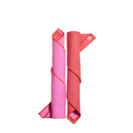Two rolled-up napkins, one pink and one red, on a white background.