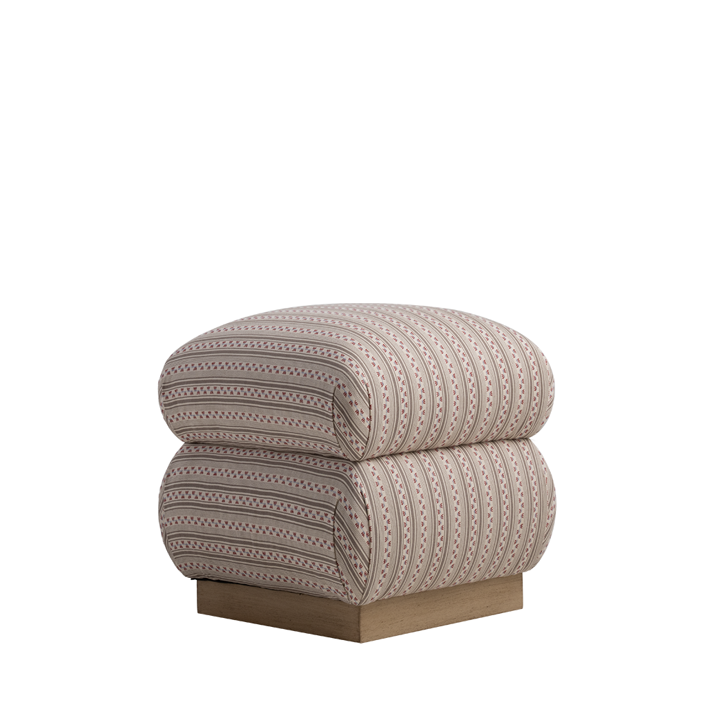 A modern upholstered ottoman with a stacked cushion design, featuring a beige and brown geometric patterned fabric on a low wooden base, shown against a plain white background.