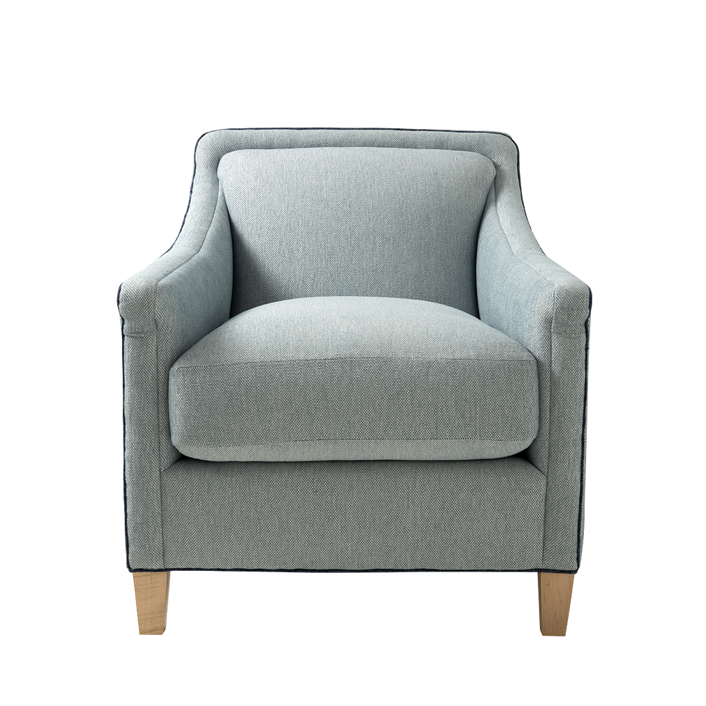A light blue-gray upholstered armchair with a high back, wide armrests, and light natural wood legs, shown against a plain white background.