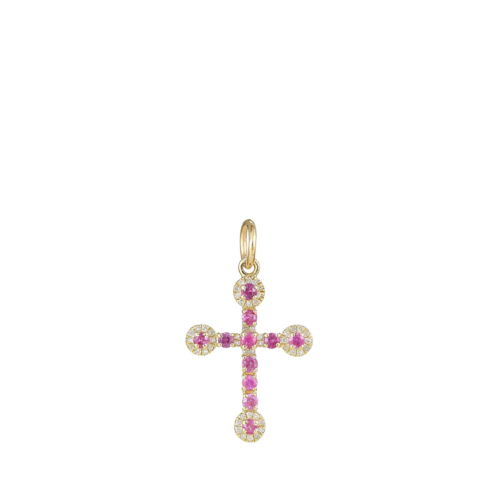 Gold cross pendant with pink gemstones on a white background