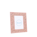 Pink photo frame with floral design on a white background