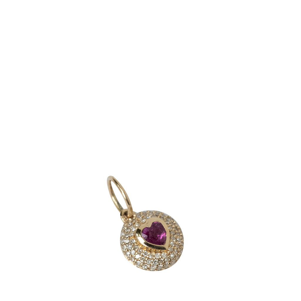 Gold pendant with a heart-shaped purple gemstone on a white background