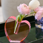 mage of pink acrylic heart vase on a tray 