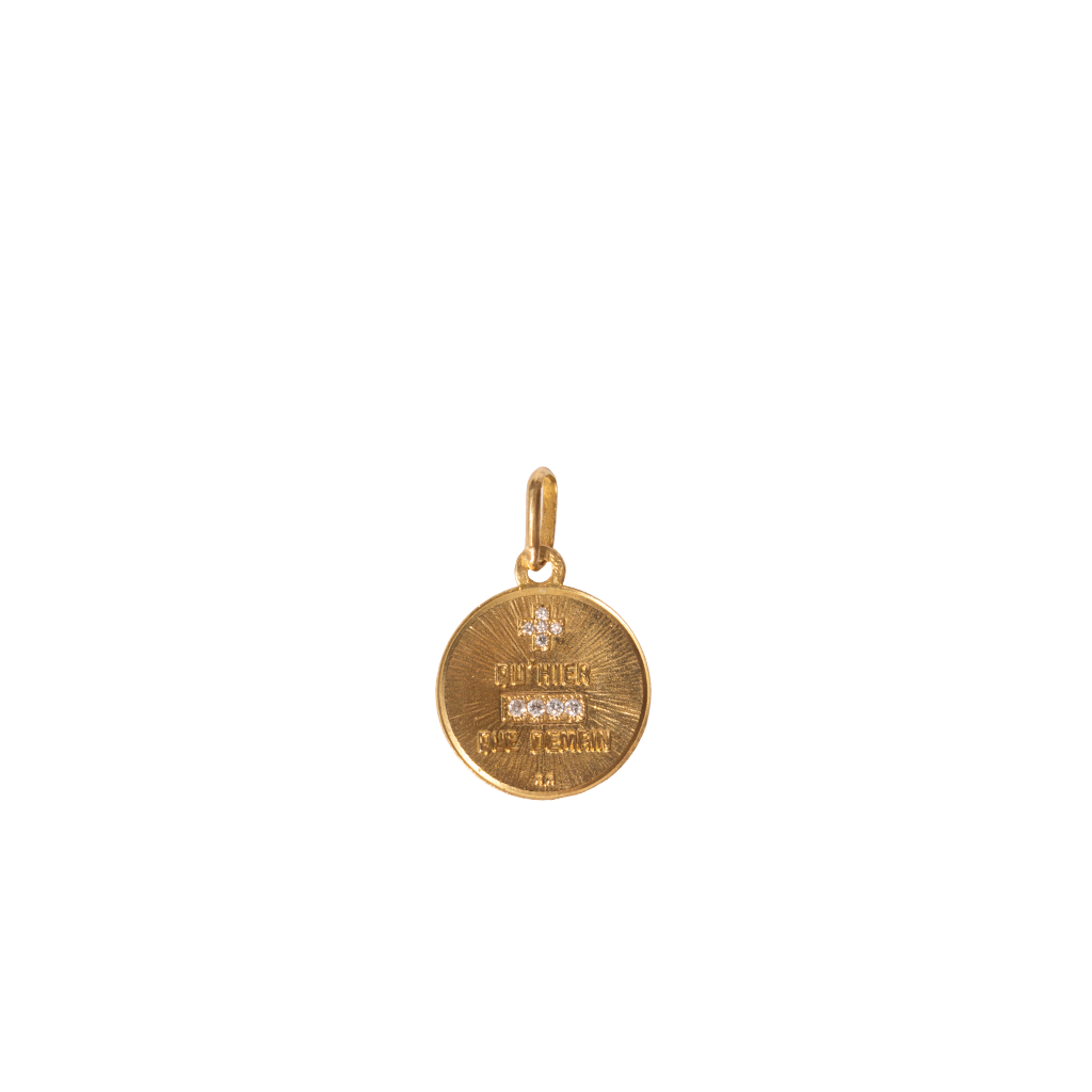 Gold pendant on a white background